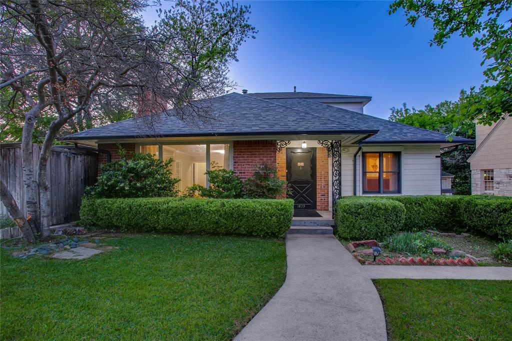 1439 Jr Drive Dallas, TX 75208 - Photo 2 of 39 a front view of a house with a garden