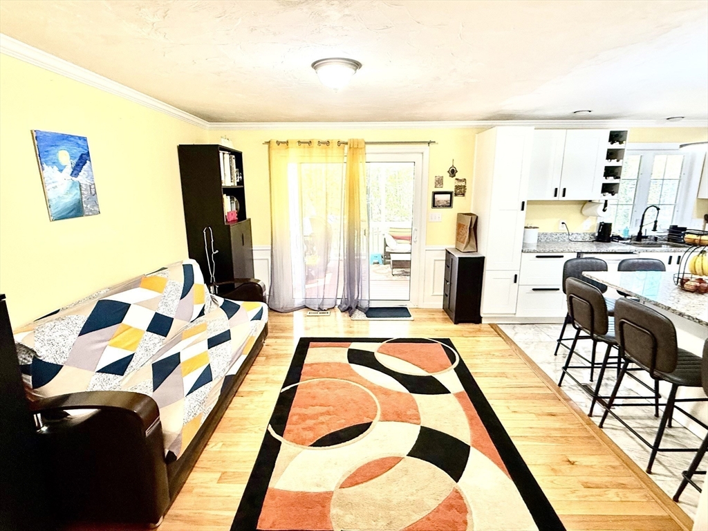 19 Fairview Road, Unit A Framingham, MA 01702 - Photo 6 of 28 a spacious bedroom with a bed and large windows