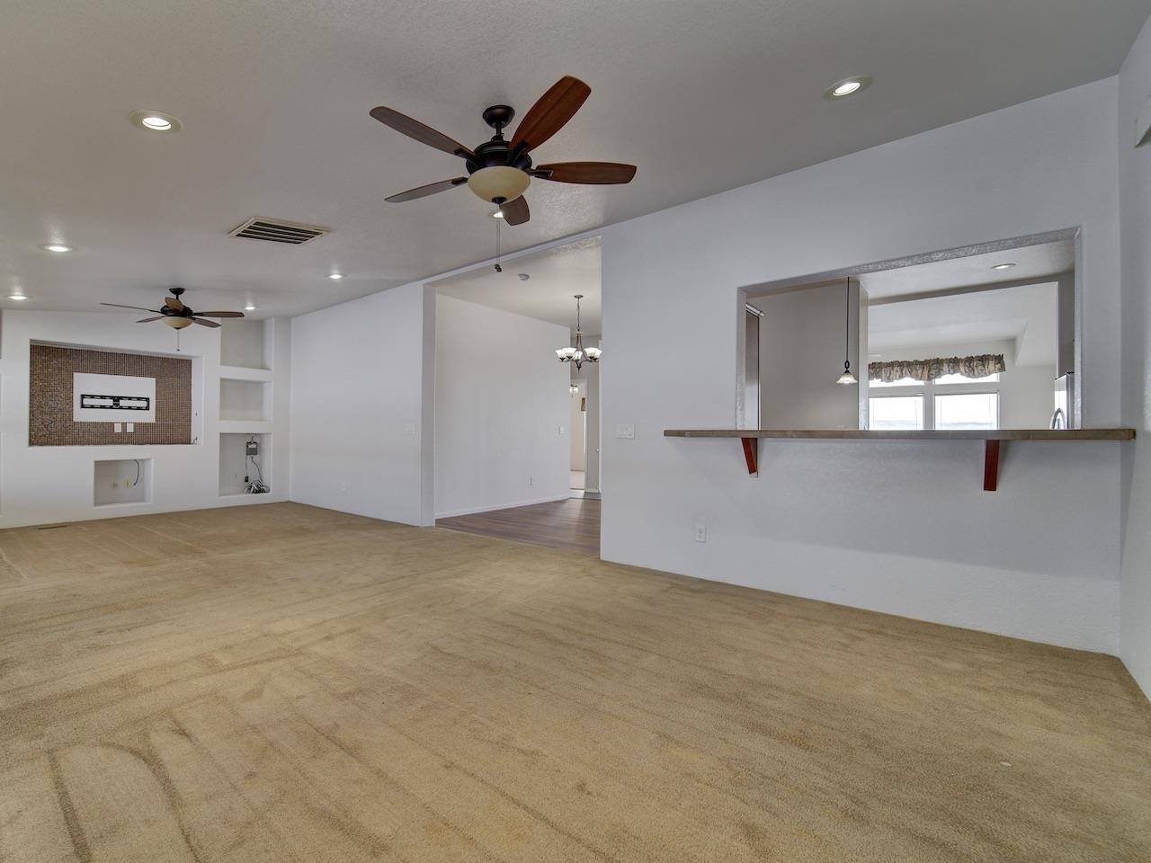 2423 16 Road Loma, CO 81524 - Photo 12 of 38 a view of a livingroom with a ceiling fan and window