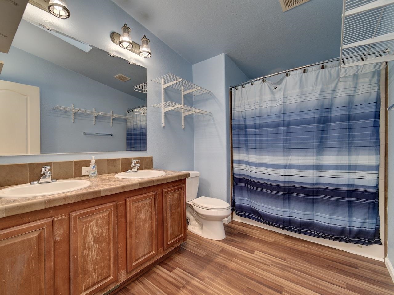 2423 16 Road Loma, CO 81524 - Photo 19 of 38 a bathroom with a sink a toilet and shower