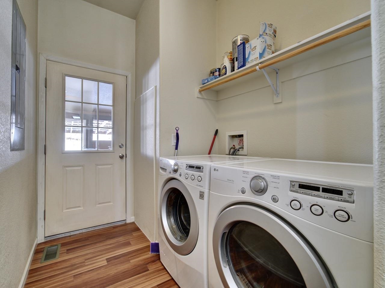 2423 16 Road Loma, CO 81524 - Photo 22 of 38 a view of washer and dryer with kitchen in the background