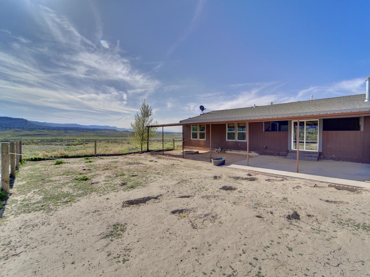 2423 16 Road Loma, CO 81524 - Photo 25 of 38 a view of a house with a yard