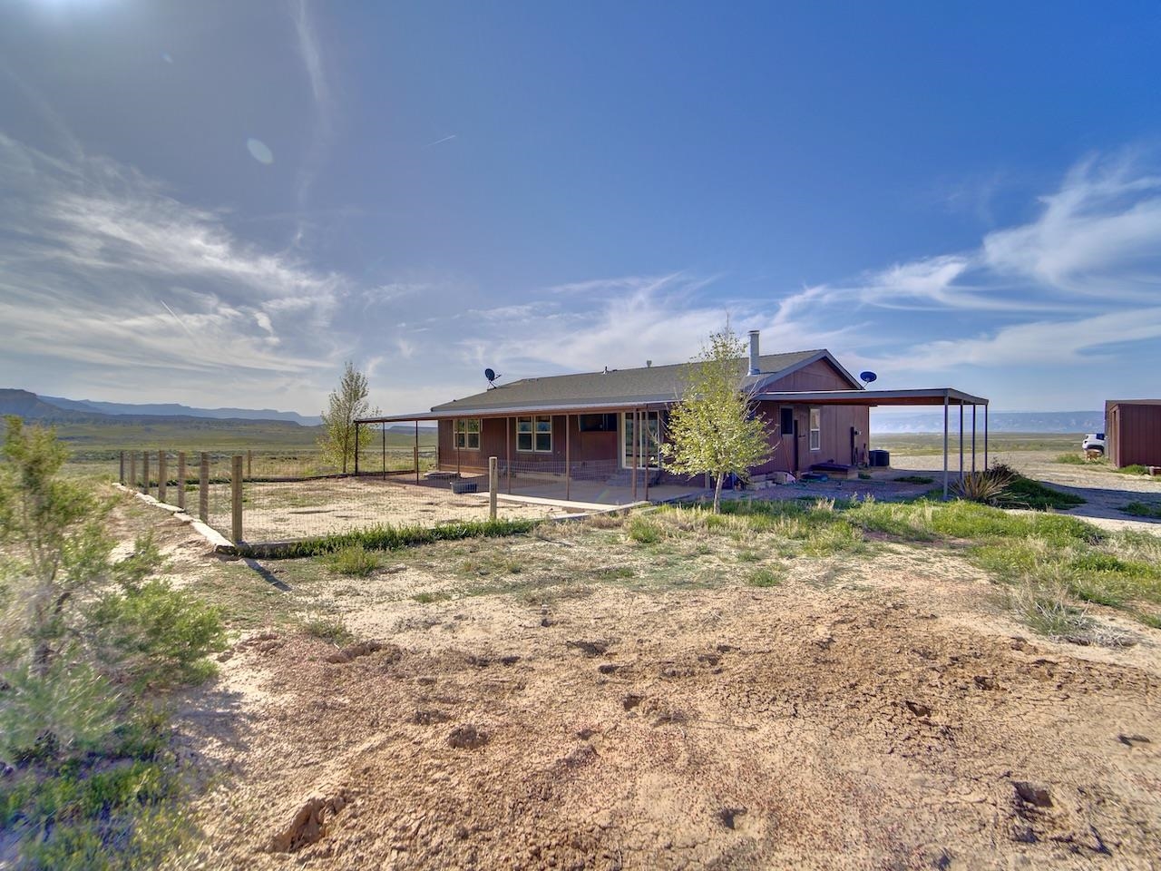 2423 16 Road Loma, CO 81524 - Photo 28 of 38 a view of a house with backyard and sitting area