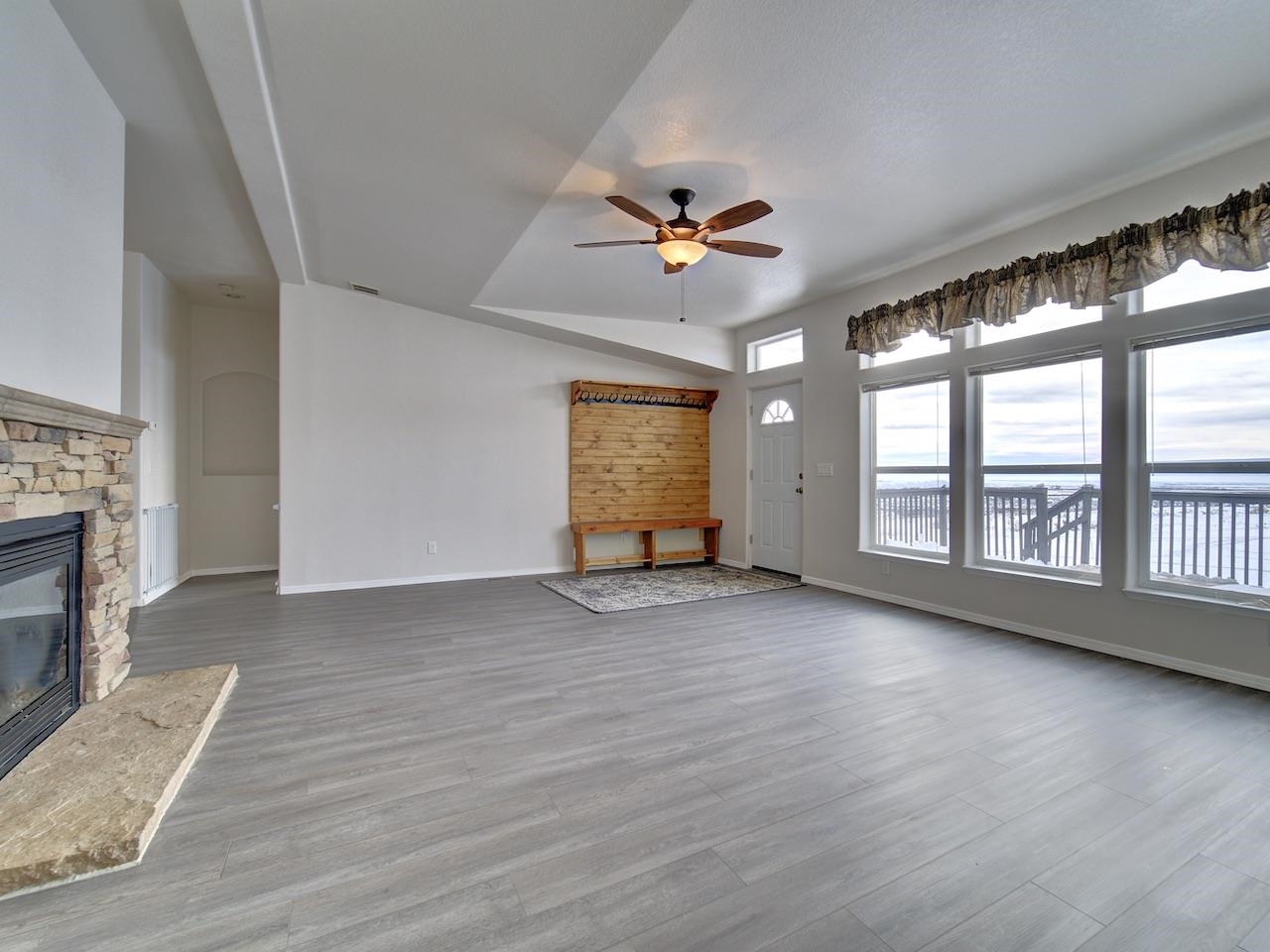 2423 16 Road Loma, CO 81524 - Photo 4 of 38 a view of an empty room with a window and wooden floor