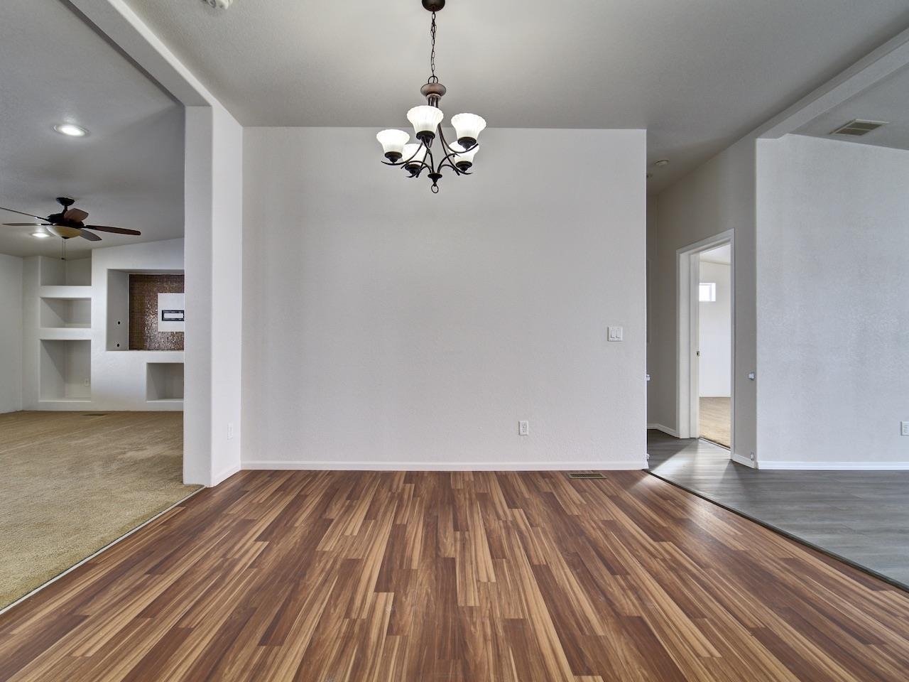 2423 16 Road Loma, CO 81524 - Photo 10 of 38 a view of a room with wooden floor chandelier and entryway
