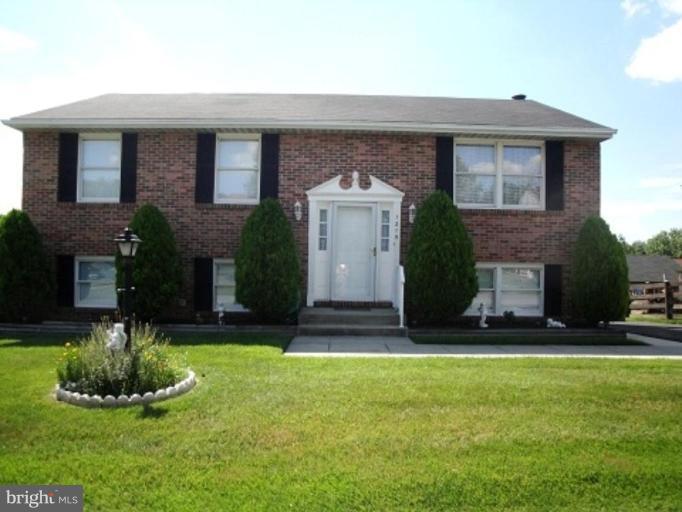 1215 Roxboro Road Rosedale, MD 21237 - Photo 1 of 29 a front view of a house with a yard