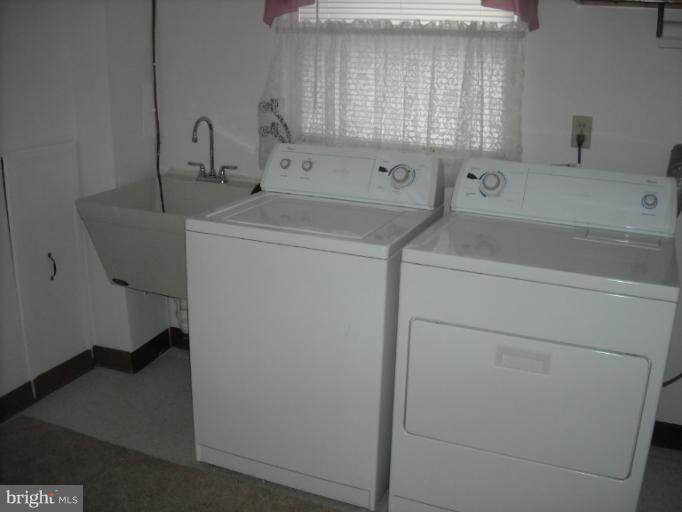 1215 Roxboro Road Rosedale, MD 21237 - Photo 15 of 29 a utility room with dryer and washer