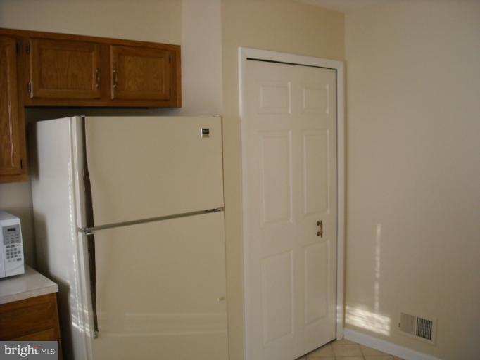 1215 Roxboro Road Rosedale, MD 21237 - Photo 18 of 29 a white refrigerator freezer and a microwave
