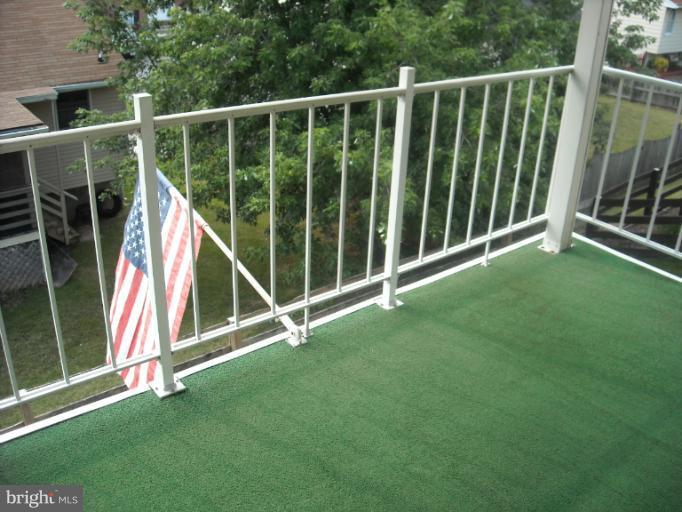1215 Roxboro Road Rosedale, MD 21237 - Photo 19 of 29 a view of an empty deck with a big yard and wooden fence
