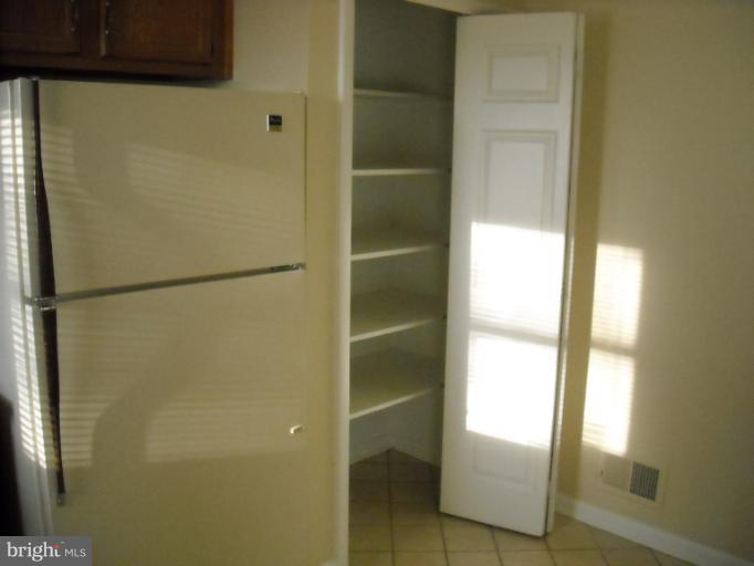 1215 Roxboro Road Rosedale, MD 21237 - Photo 20 of 29 a bathroom with a glass shower door
