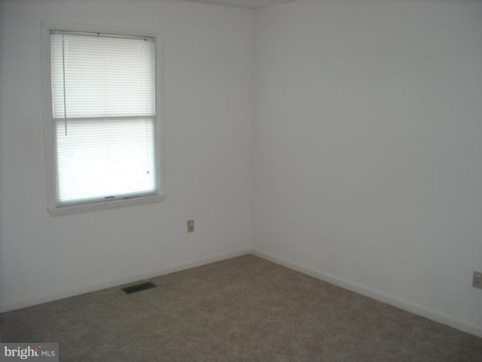 1215 Roxboro Road Rosedale, MD 21237 - Photo 24 of 29 an empty room with a window