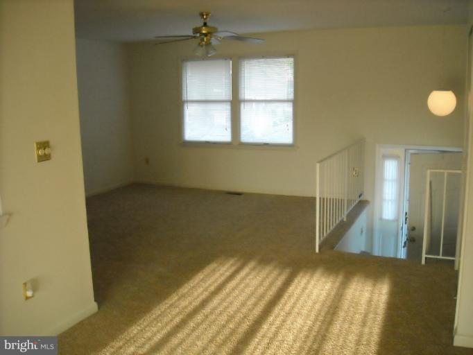 1215 Roxboro Road Rosedale, MD 21237 - Photo 6 of 29 a view of empty room with wooden floor