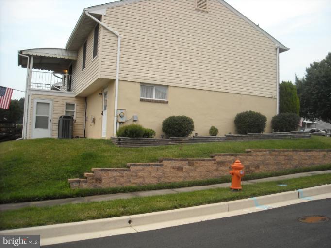 1215 Roxboro Road Rosedale, MD 21237 - Photo 7 of 29 a front view of a house with a yard