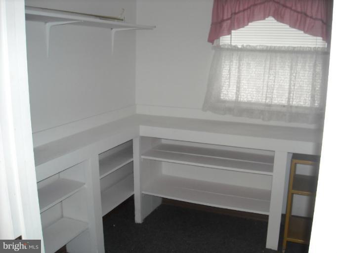 1215 Roxboro Road Rosedale, MD 21237 - Photo 9 of 29 a view of walk in closet with window