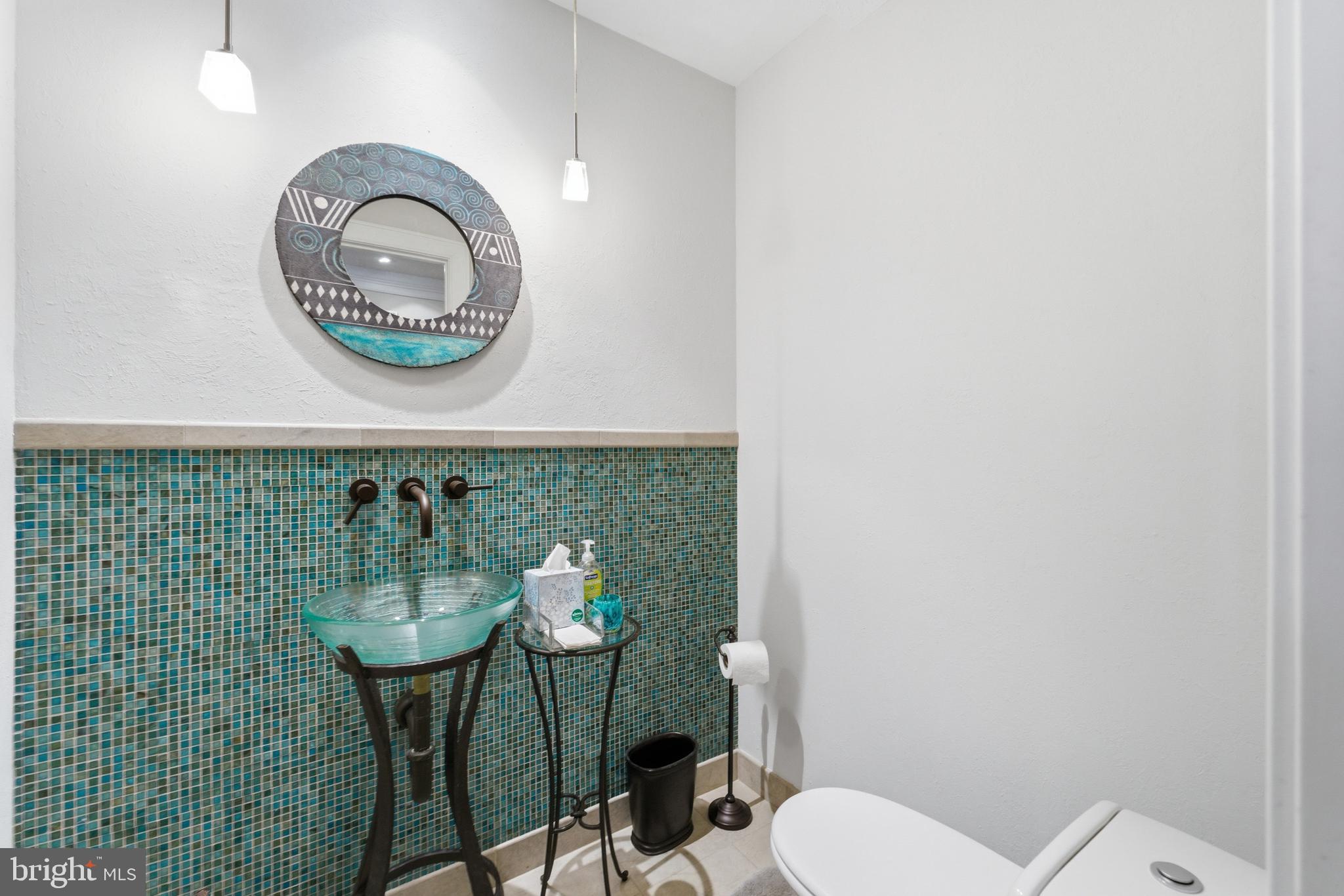 1724 Overlook Drive Silver Spring, MD 20903 - Photo 15 of 57 Chic bathroom with vibrant tile accents.