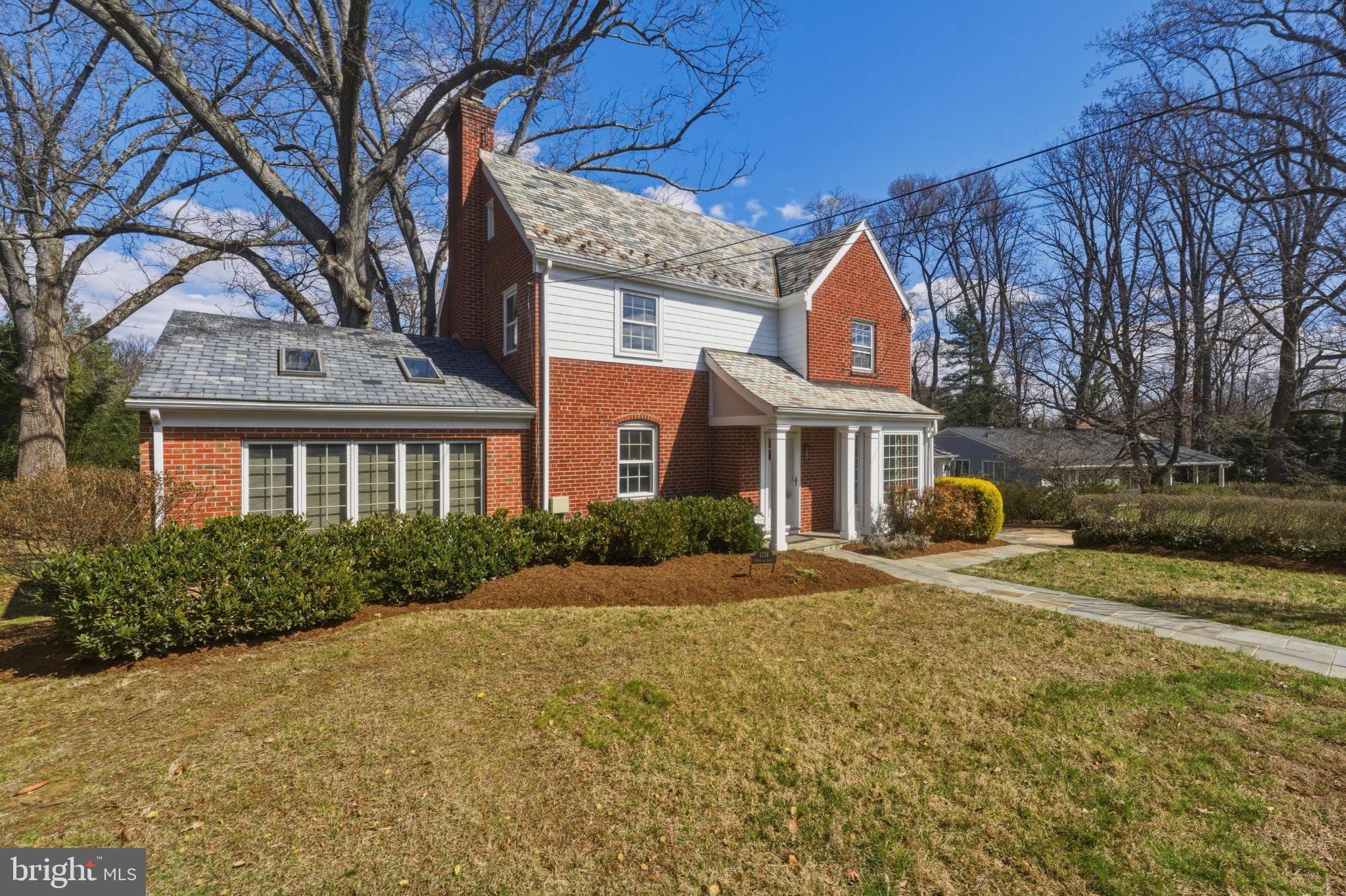 1724 Overlook Drive Silver Spring, MD 20903 - Photo 2 of 57 Charming brick home with lush greenery.