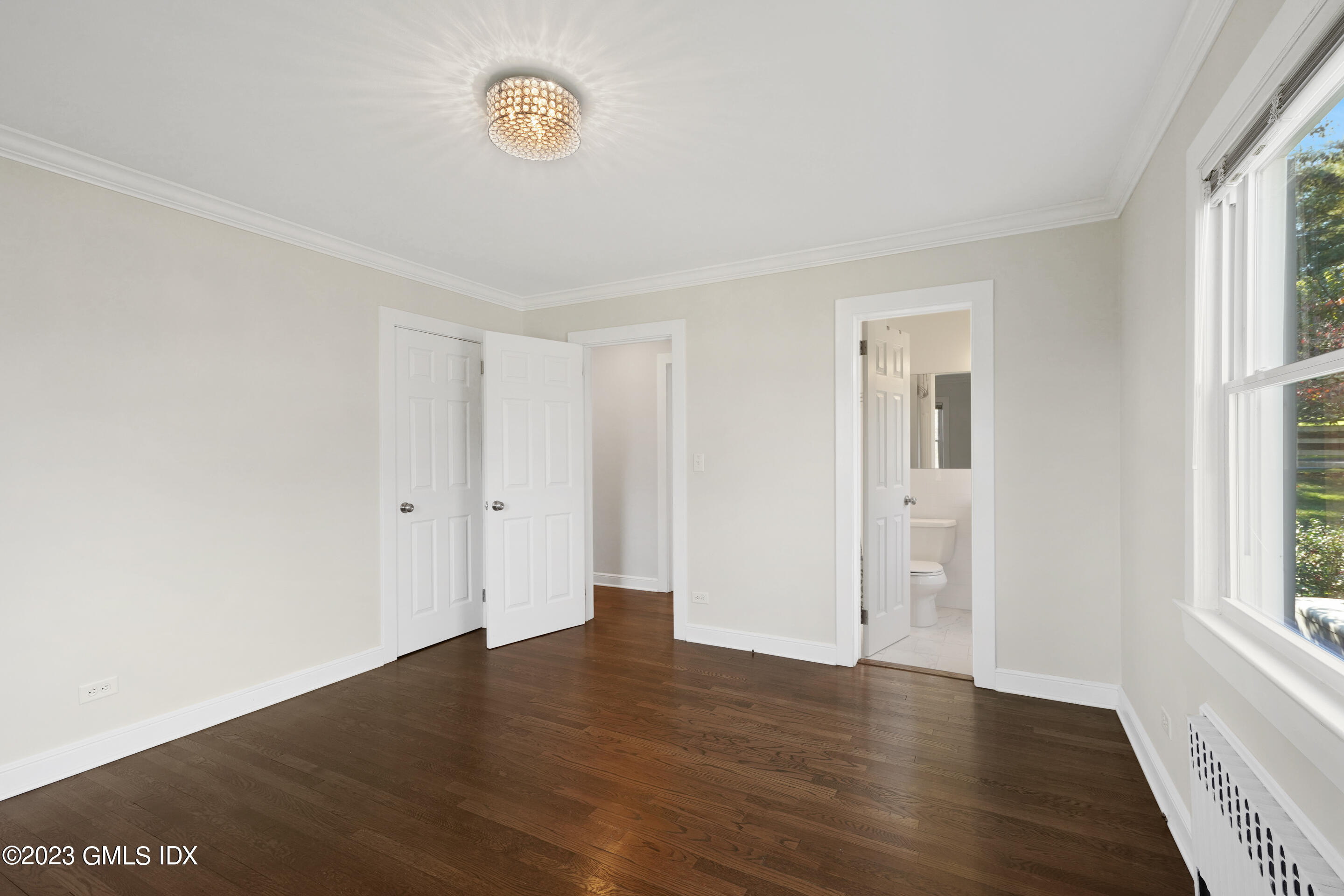 2279 High Ridge Road Stamford, CT 06903 - Photo 12 of 22 a view of an empty room with wooden floor and a window