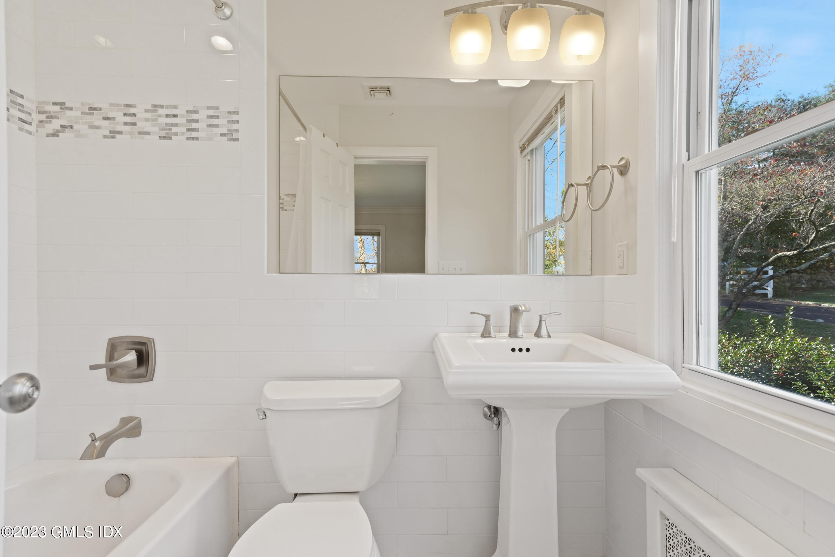 2279 High Ridge Road Stamford, CT 06903 - Photo 13 of 22 a bathroom with a sink a toilet and shower