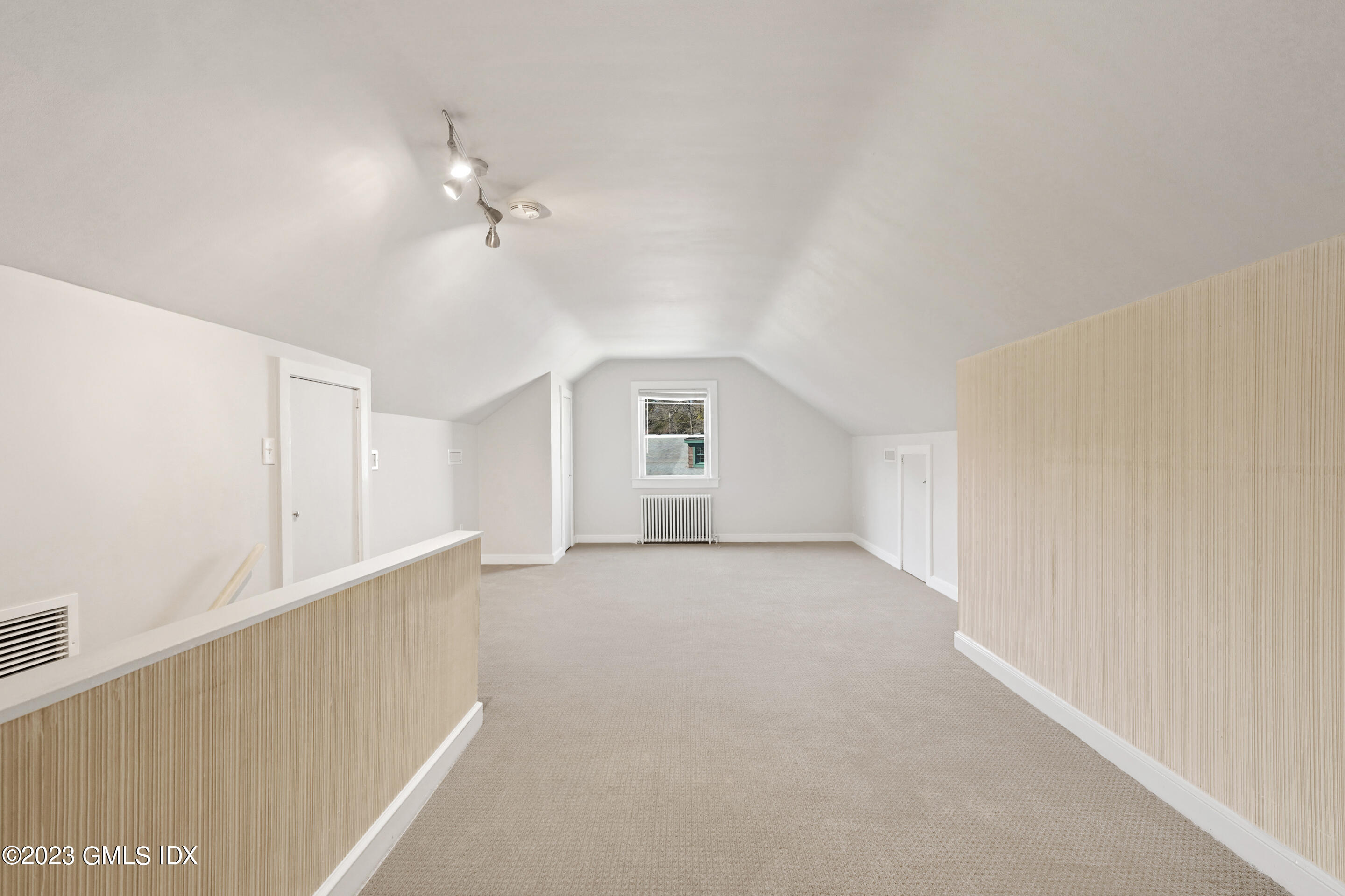 2279 High Ridge Road Stamford, CT 06903 - Photo 14 of 22 a view of a big room with windows and ceiling fan