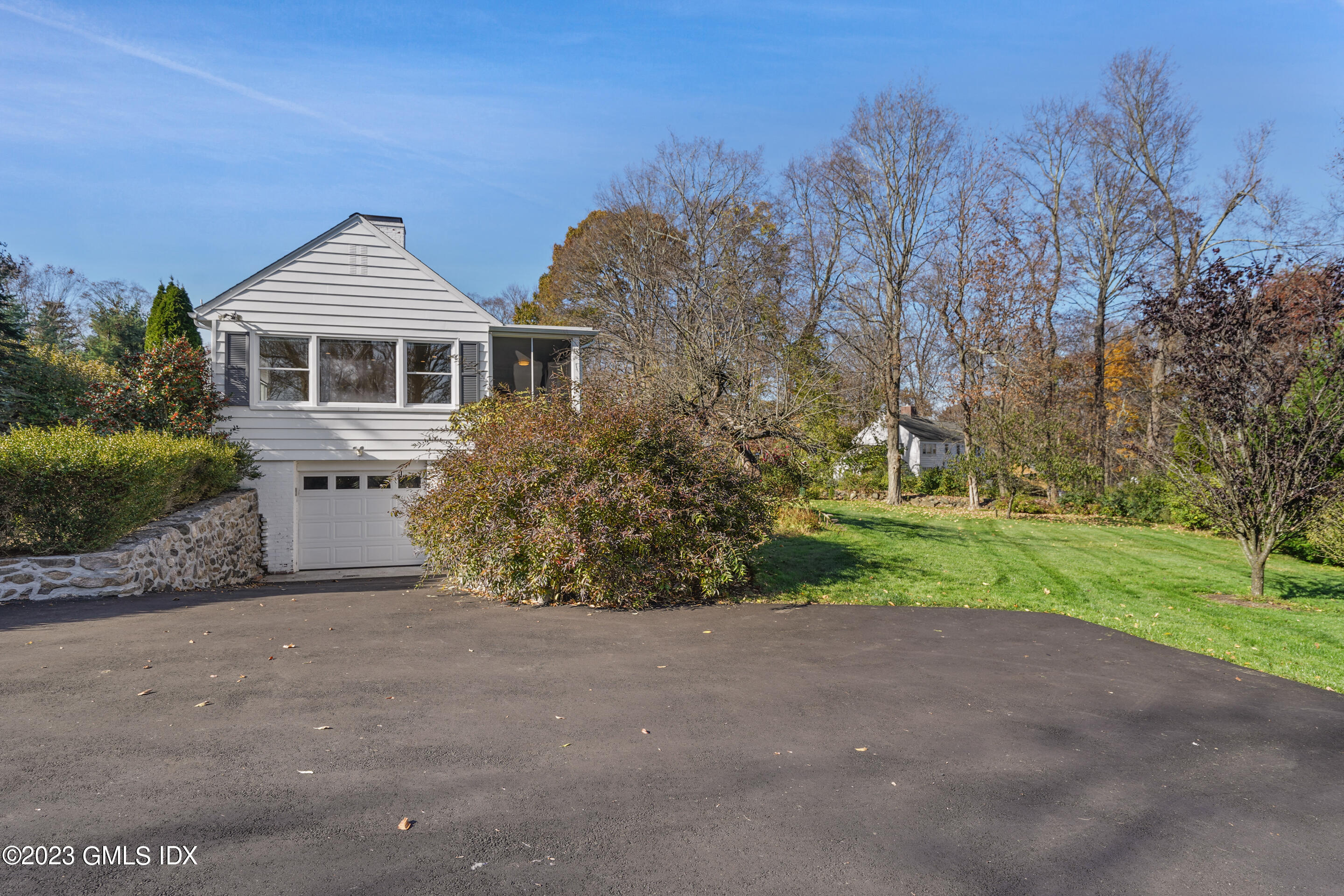 2279 High Ridge Road Stamford, CT 06903 - Photo 20 of 22 a front view of house with yard and green space