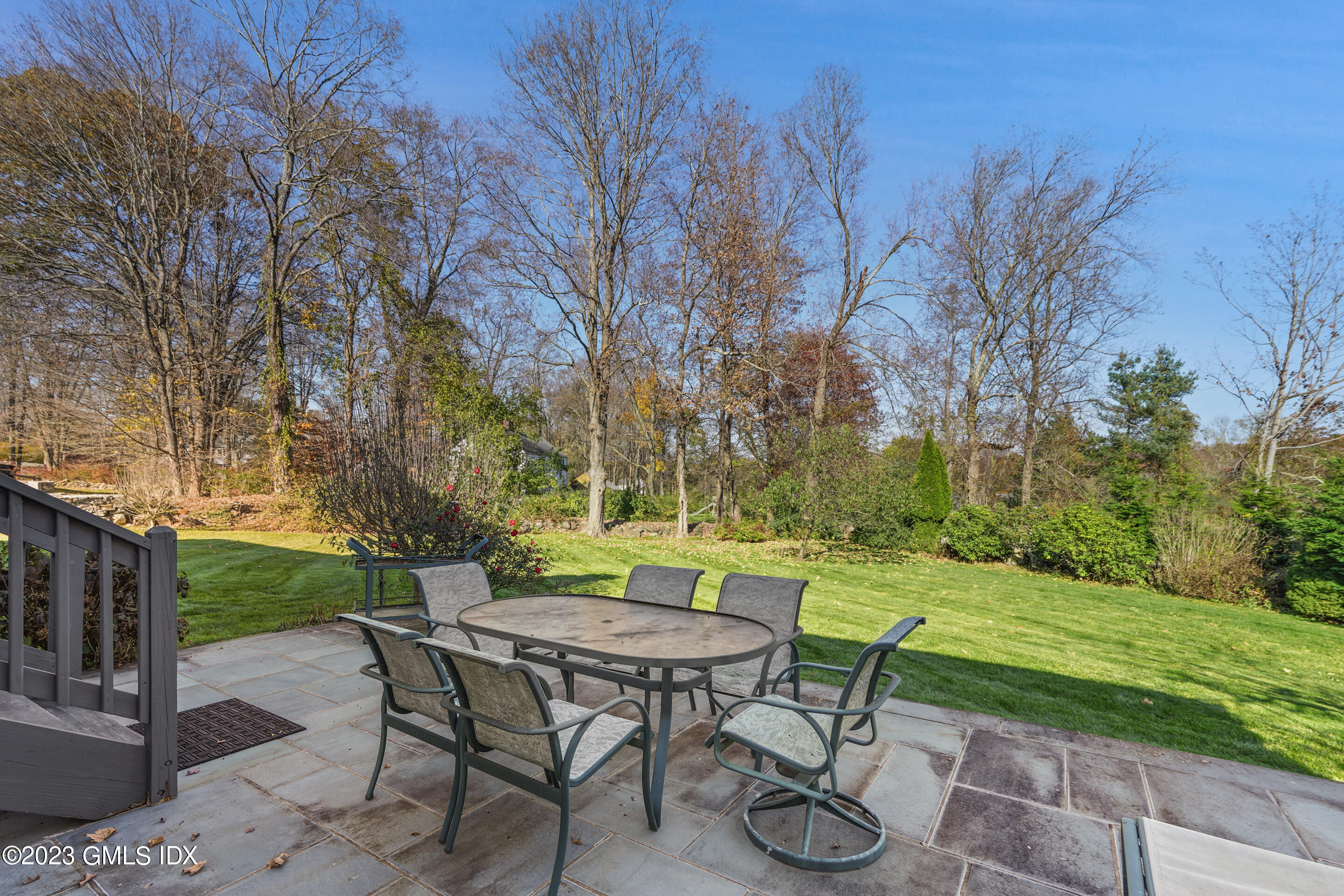 2279 High Ridge Road Stamford, CT 06903 - Photo 21 of 22 a view of a chairs and table in backyard of the house