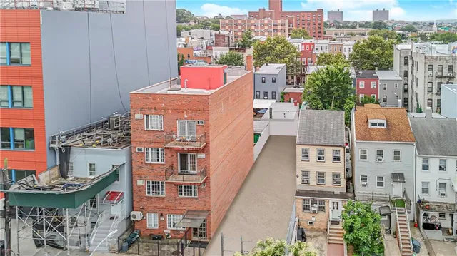 a view of street with tall buildings