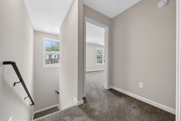 a view of room with window and ceiling fan
