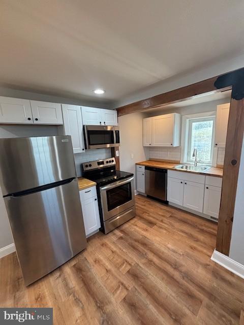 1205 Manor Road Windsor, PA 17366 - Photo 3 of 9 a kitchen with granite countertop a refrigerator stove and sink