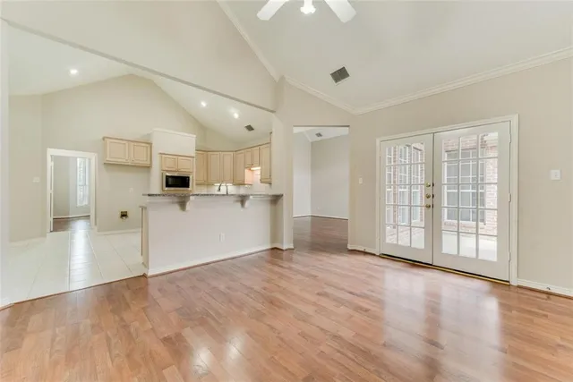 a view of a kitchen with a stove cabinets and wooden floor