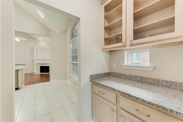 a view of a kitchen cabinets and a window