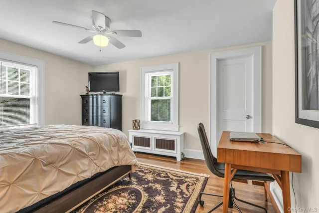 a bedroom with a bed and a table in it