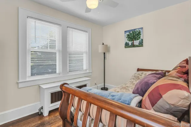 a bedroom with furniture and a window