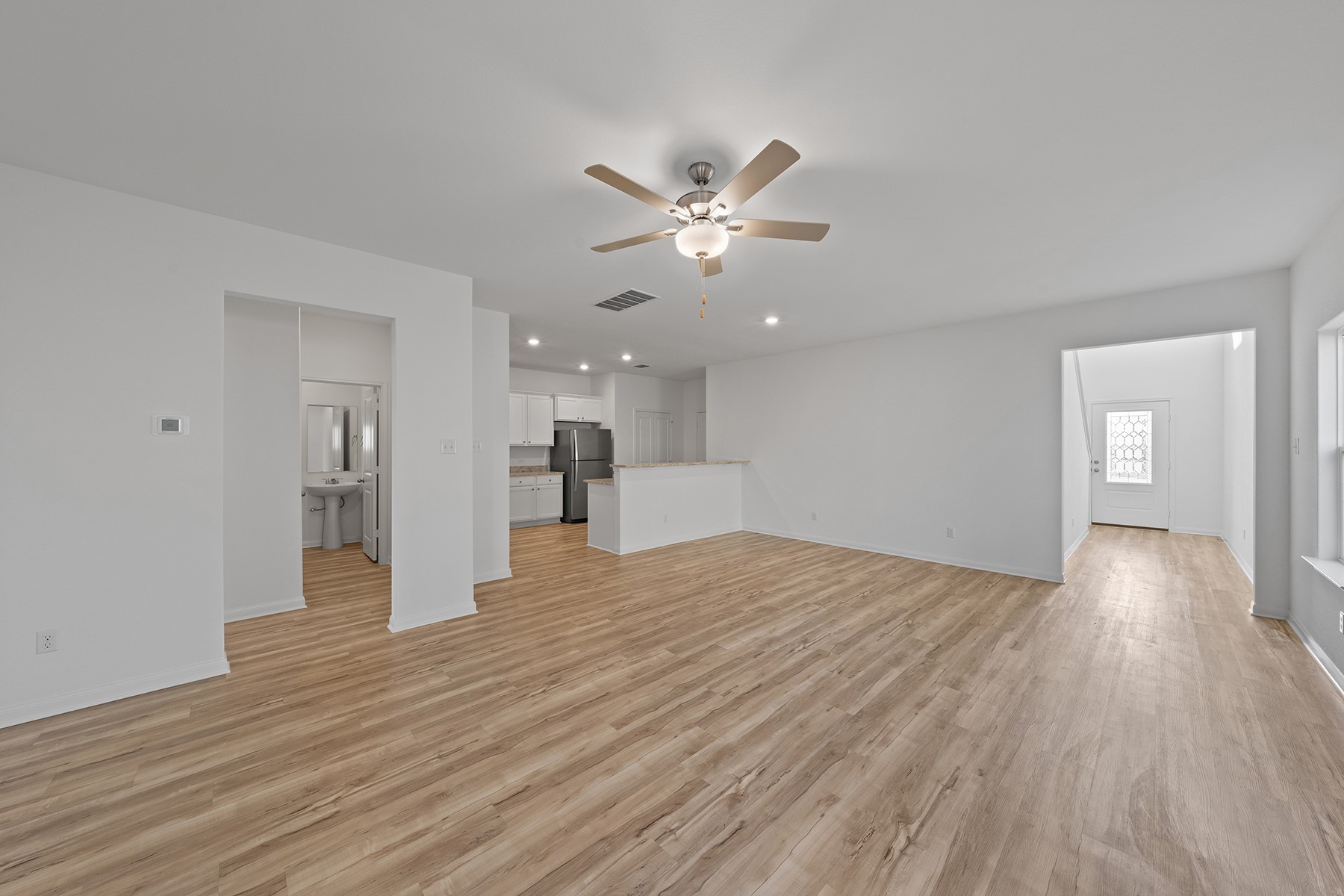 197 Fairlawn Way Maxwell, TX 78656 - Photo 2 of 14 Unfurnished living room featuring recessed lighting, light wood finished floors, and ceiling fan