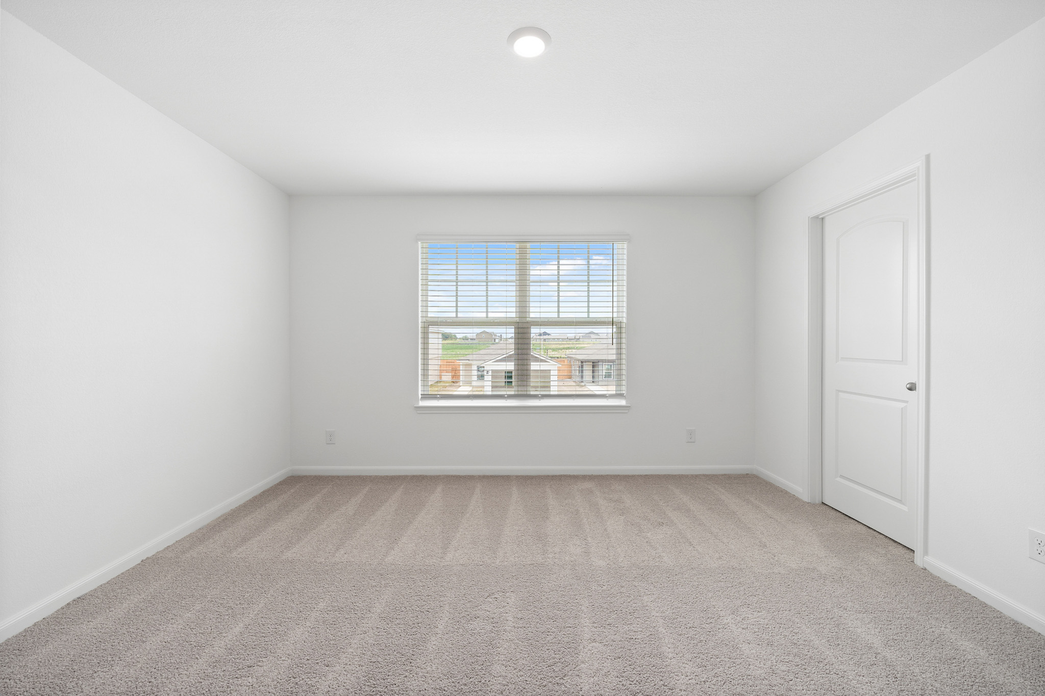 197 Fairlawn Way Maxwell, TX 78656 - Photo 9 of 14 Unfurnished room with light colored carpet and baseboards