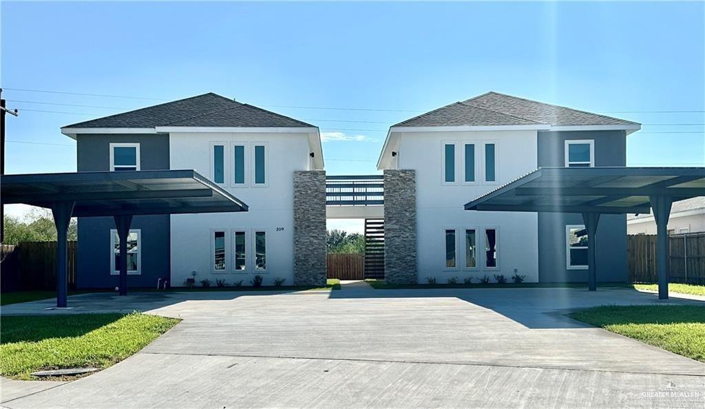 209 Rafael Drive, Unit 2 San Juan, TX 78589 - Photo 1 of 13 a front view of a house with a yard
