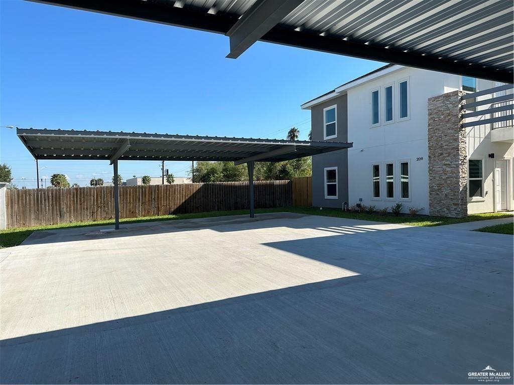 209 Rafael Drive, Unit 2 San Juan, TX 78589 - Photo 2 of 13 a front view of a house with a yard