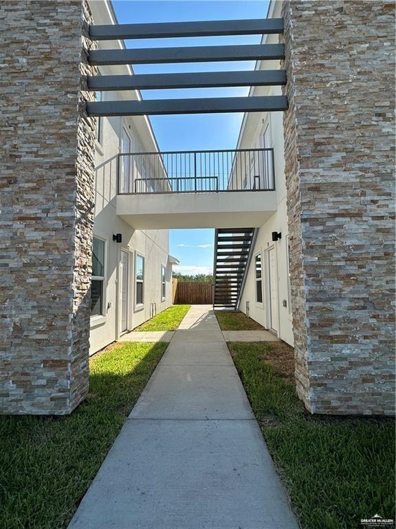 209 Rafael Drive, Unit 2 San Juan, TX 78589 - Photo 3 of 13 a front view of a house with a yard