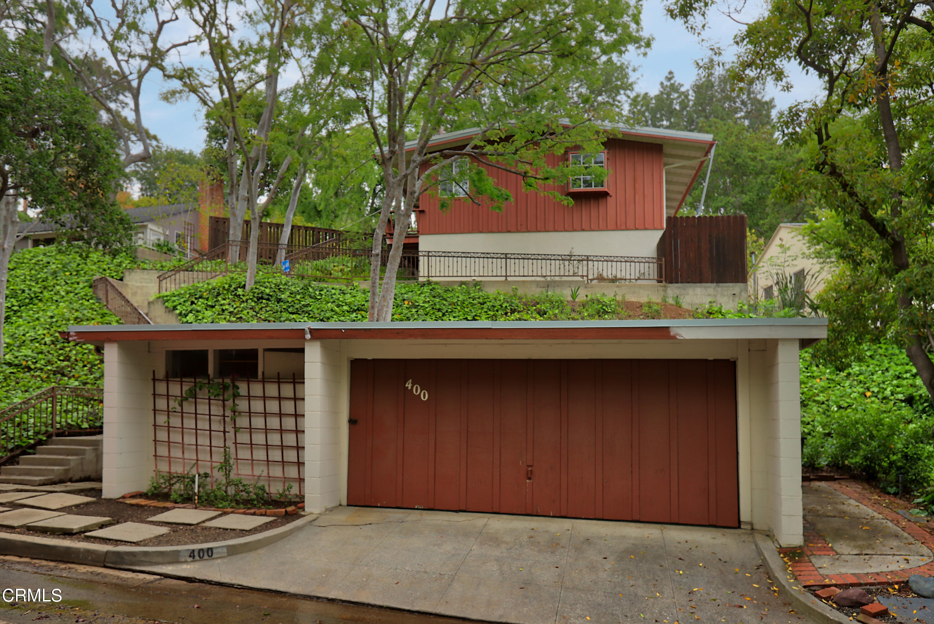 a front view of a house with a garage