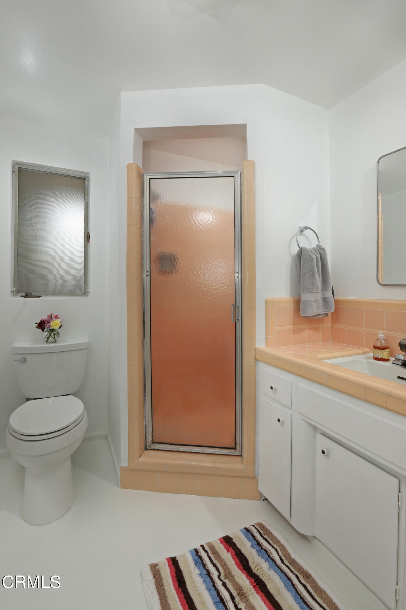 400 Glenullen Drive Pasadena, CA 91105 - Photo 11 of 19 a bathroom with a toilet a sink and mirror