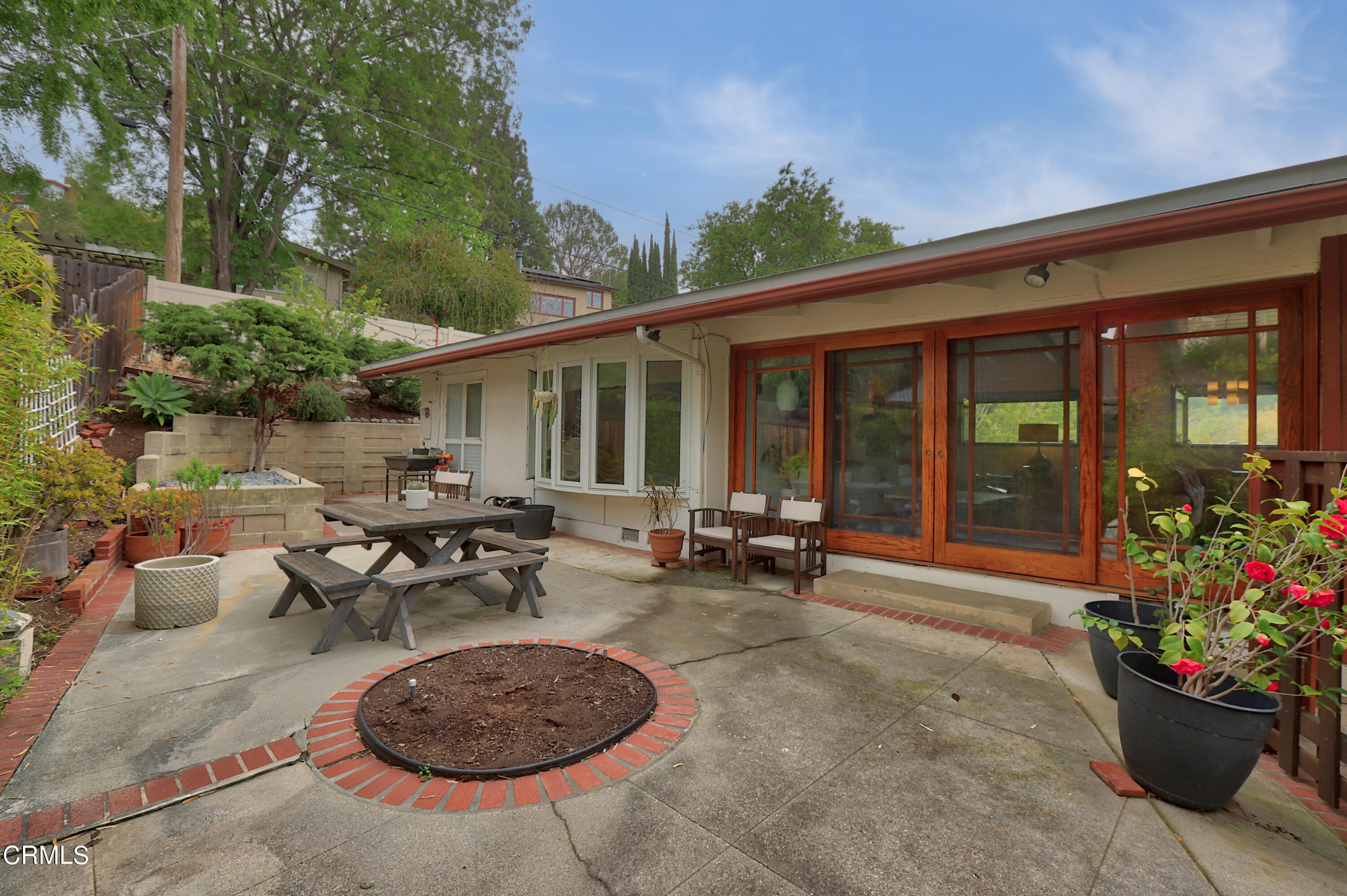 400 Glenullen Drive Pasadena, CA 91105 - Photo 13 of 19 a view of a patio with a table and chairs in patio