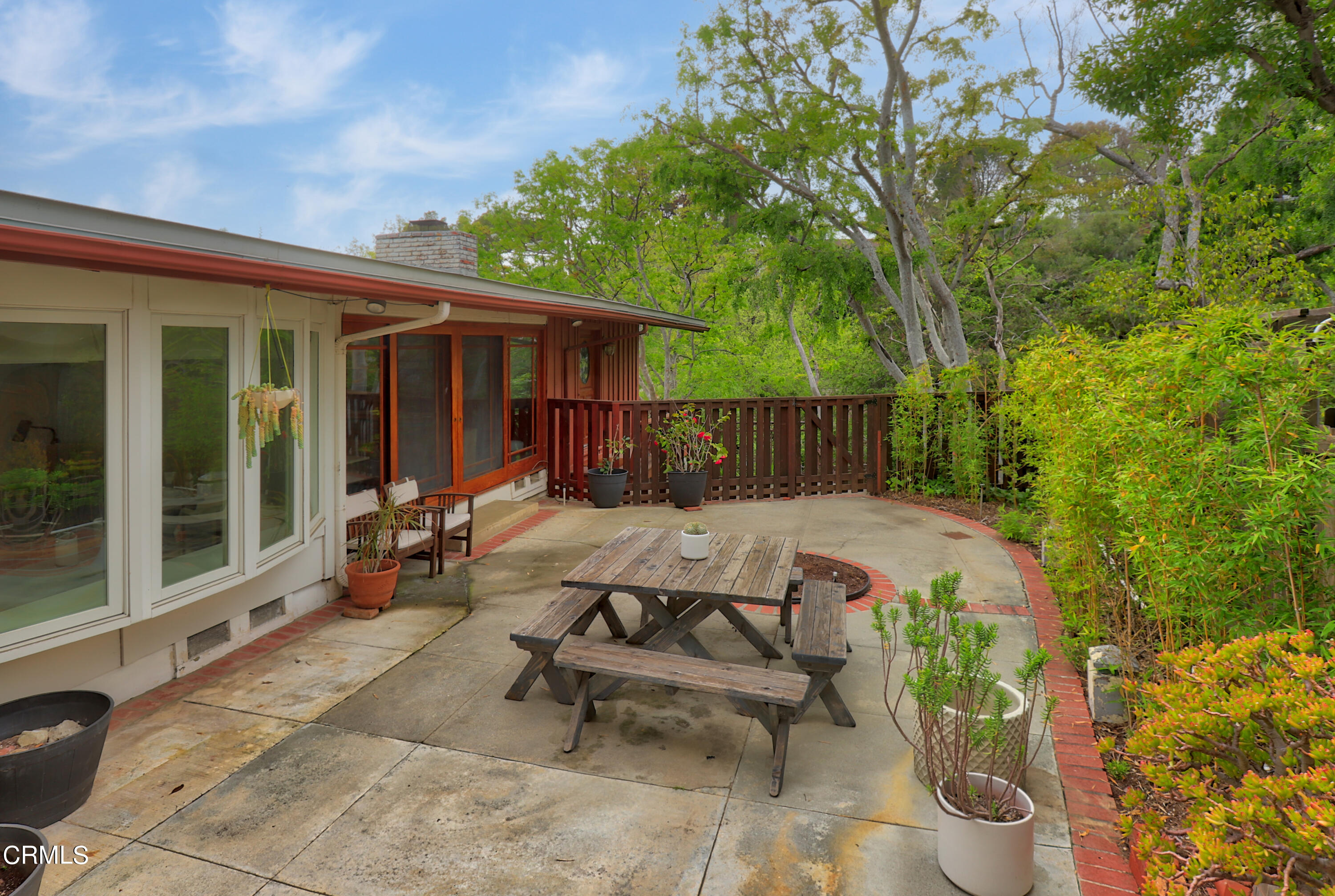 400 Glenullen Drive Pasadena, CA 91105 - Photo 14 of 19 a view of a patio with table and chairs and potted plants