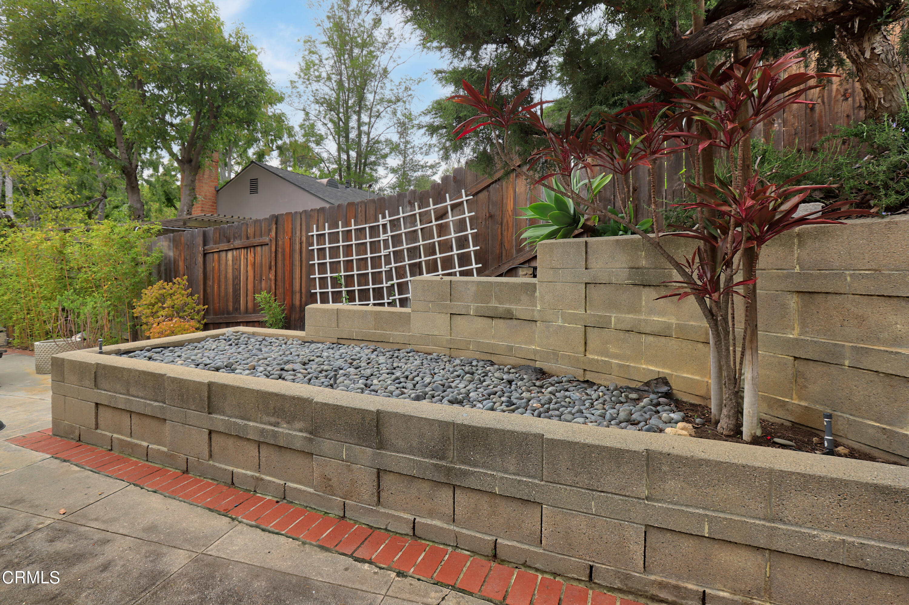 400 Glenullen Drive Pasadena, CA 91105 - Photo 15 of 19 a view of a wooden fence and a tree
