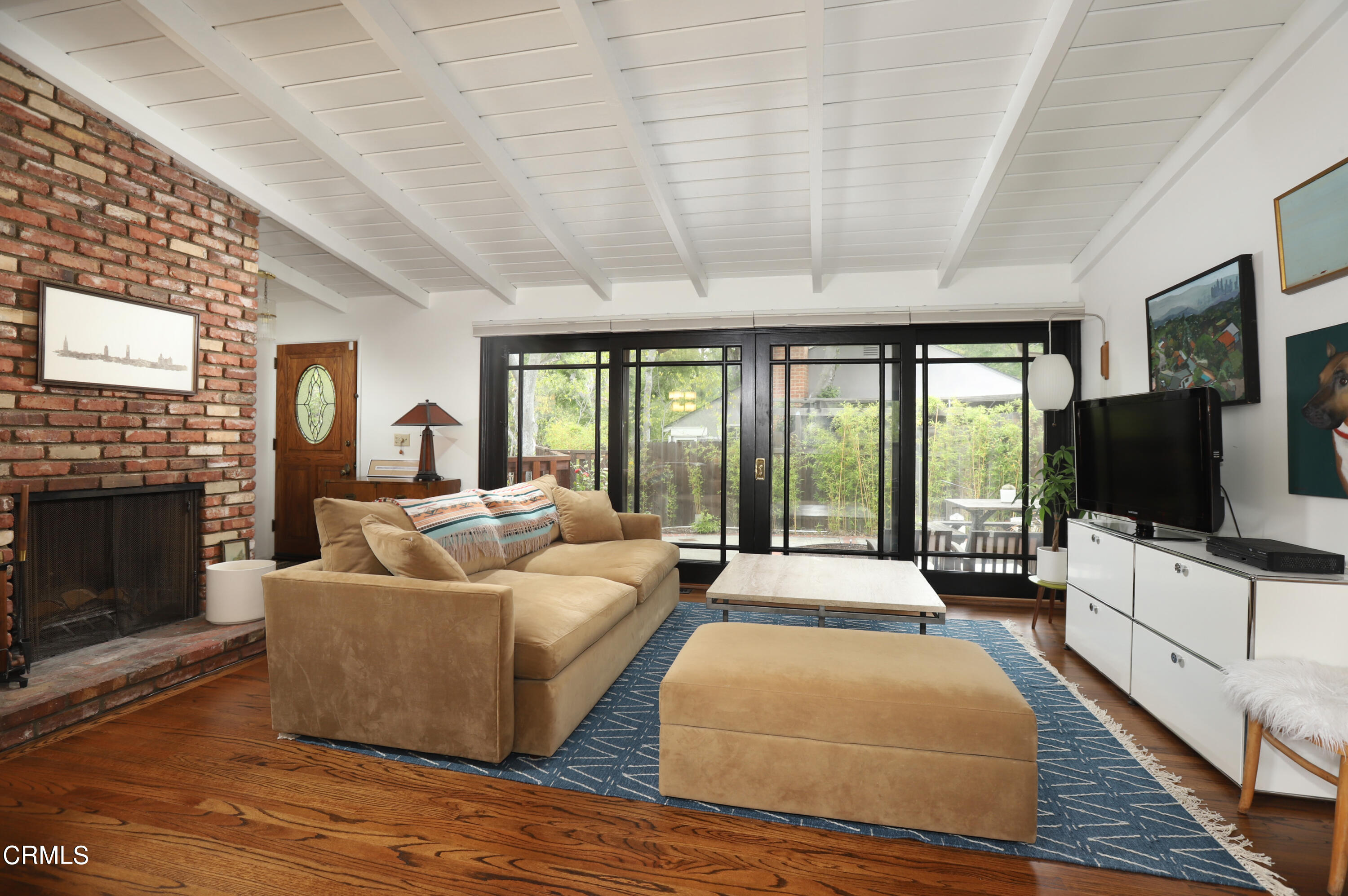 400 Glenullen Drive Pasadena, CA 91105 - Photo 3 of 19 a spacious bedroom with a large bed and a flat screen tv