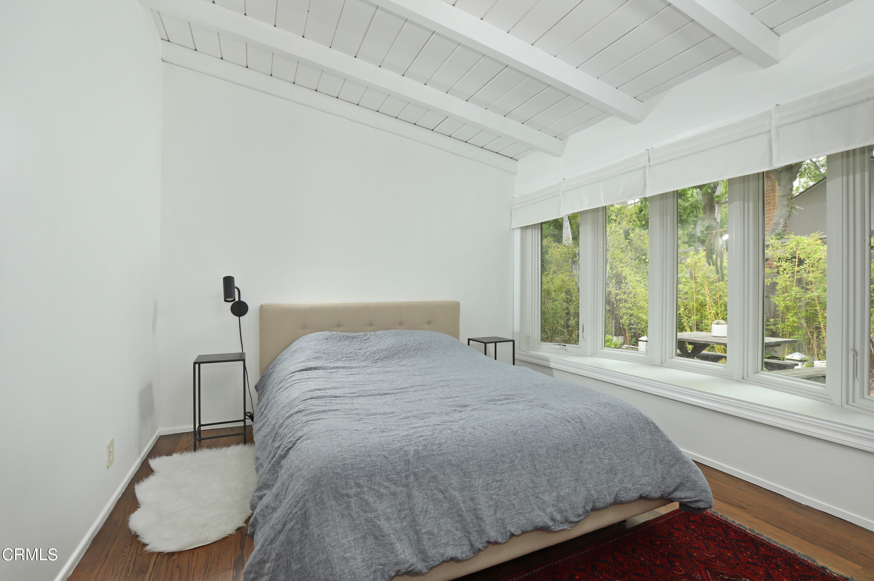 400 Glenullen Drive Pasadena, CA 91105 - Photo 9 of 19 a bedroom with a bed and a large window