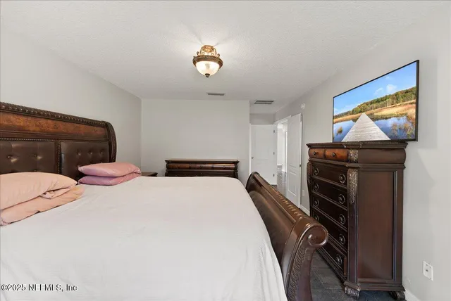 a bathroom with a double vanity sink and mirror