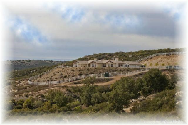 40075 Denise Road Temecula, CA 92592 - Photo 1 of 1 a view of a large building with mountains in the background