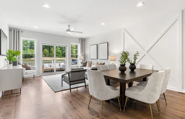 a view of a dining room with furniture window and wooden floor