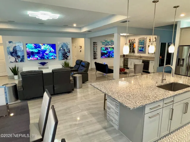 a view of a livingroom with an empty space and a window