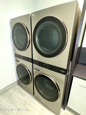a bathroom with a sink vanity toilet and shower