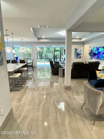 a spacious bedroom with a bed and a window